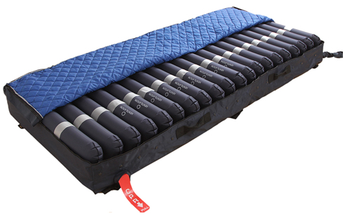 The Protekt Aire 5000DX Deluxe Alternating Pressure Mattress with Low Air Loss system shown with the removable and washable zippered cover pulled back.